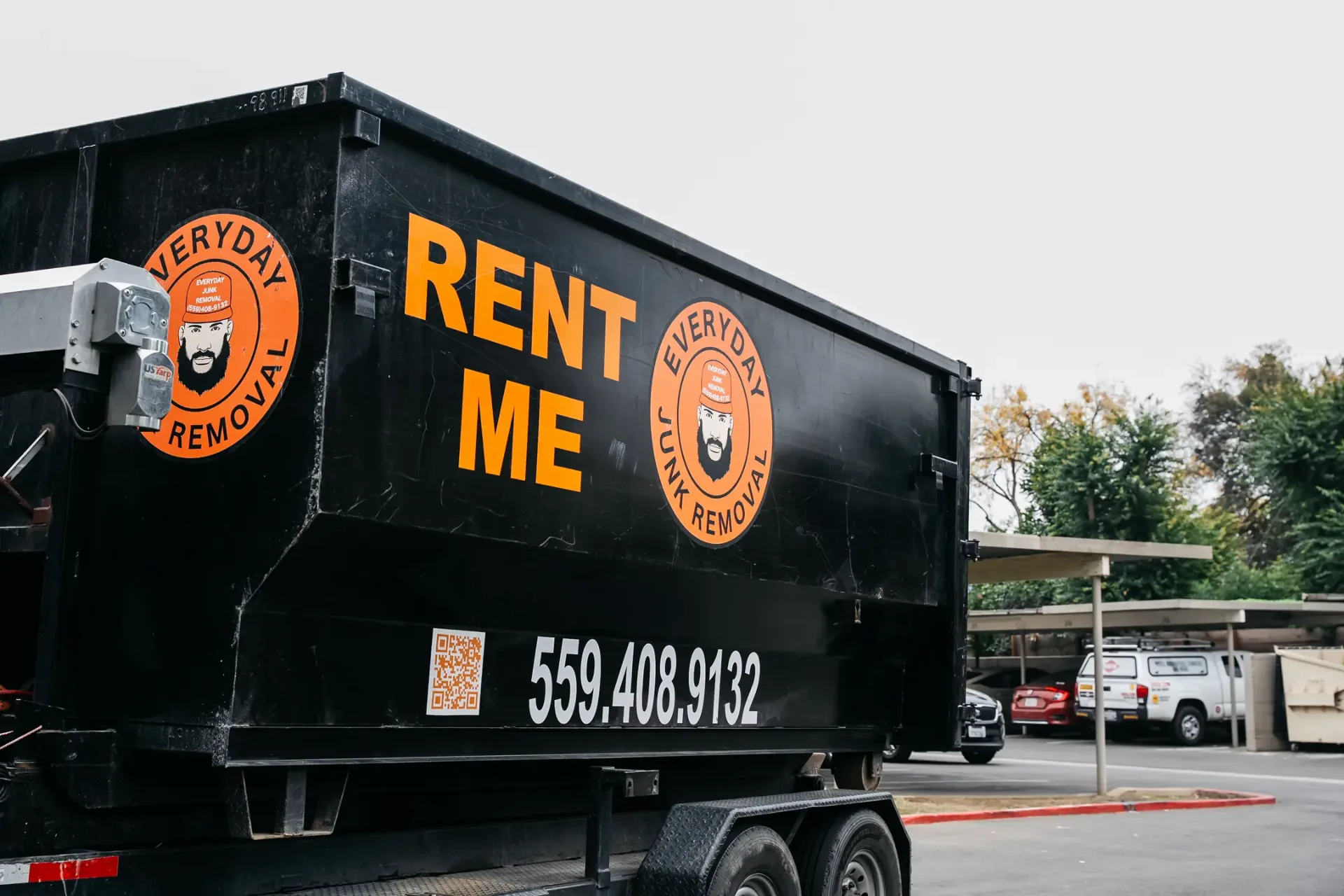 Orange roll-off dumpsters in 13, 15, and 20 yard sizes