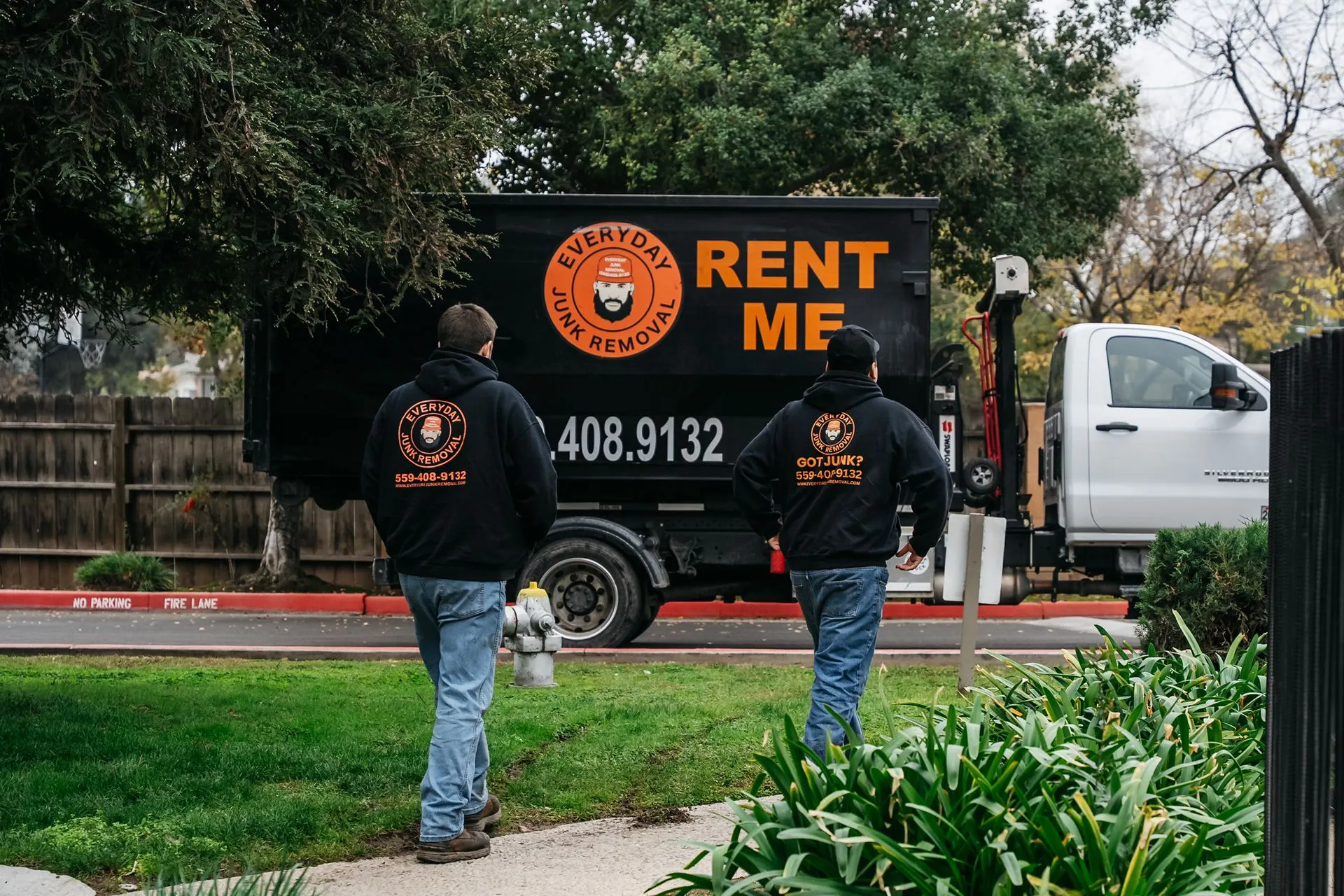 Everyday Junk Removal team with dump truck on a residential job